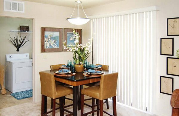 Dining room with modern decor and large windows at Esteban Park Apartments in Phoenix