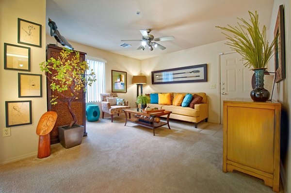 Spacious living room with modern decor at Esteban Park Apartments