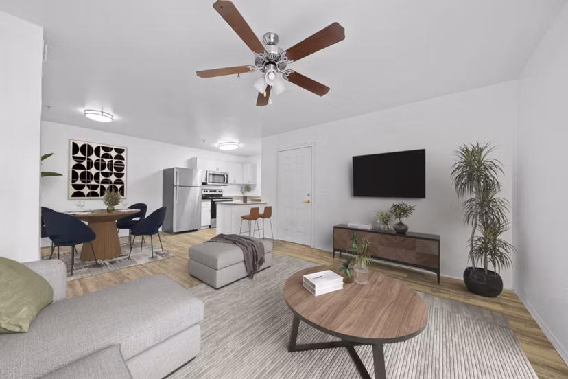 Spacious living room with modern furnishings at The Colony Apartments