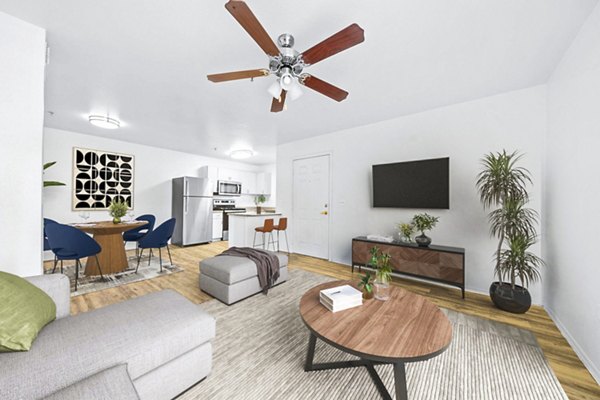 Cozy living room with modern furnishings at The Colony Apartments, a luxury Greystar community