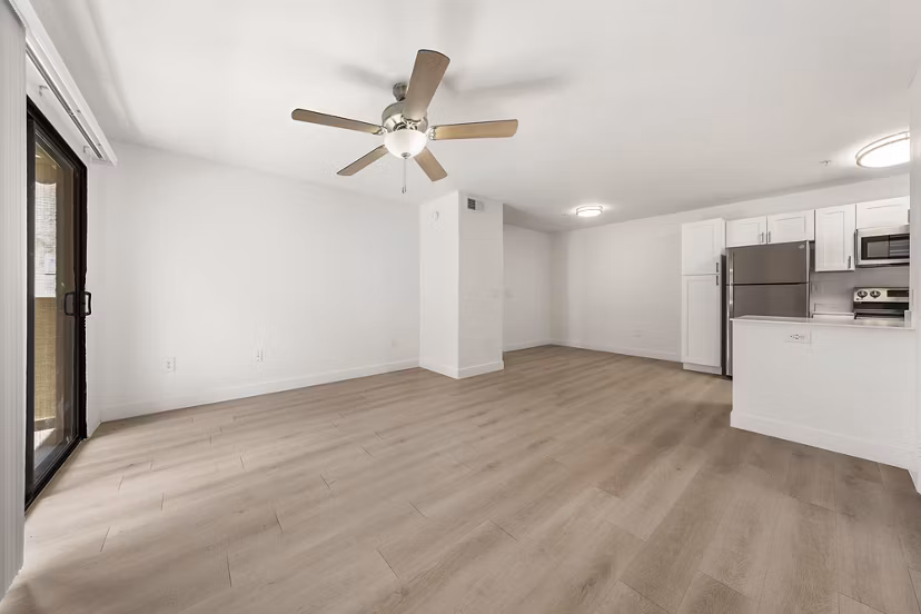 Spacious living room with modern furnishings at The Colony Apartments, offering luxury living in exclusive surroundings