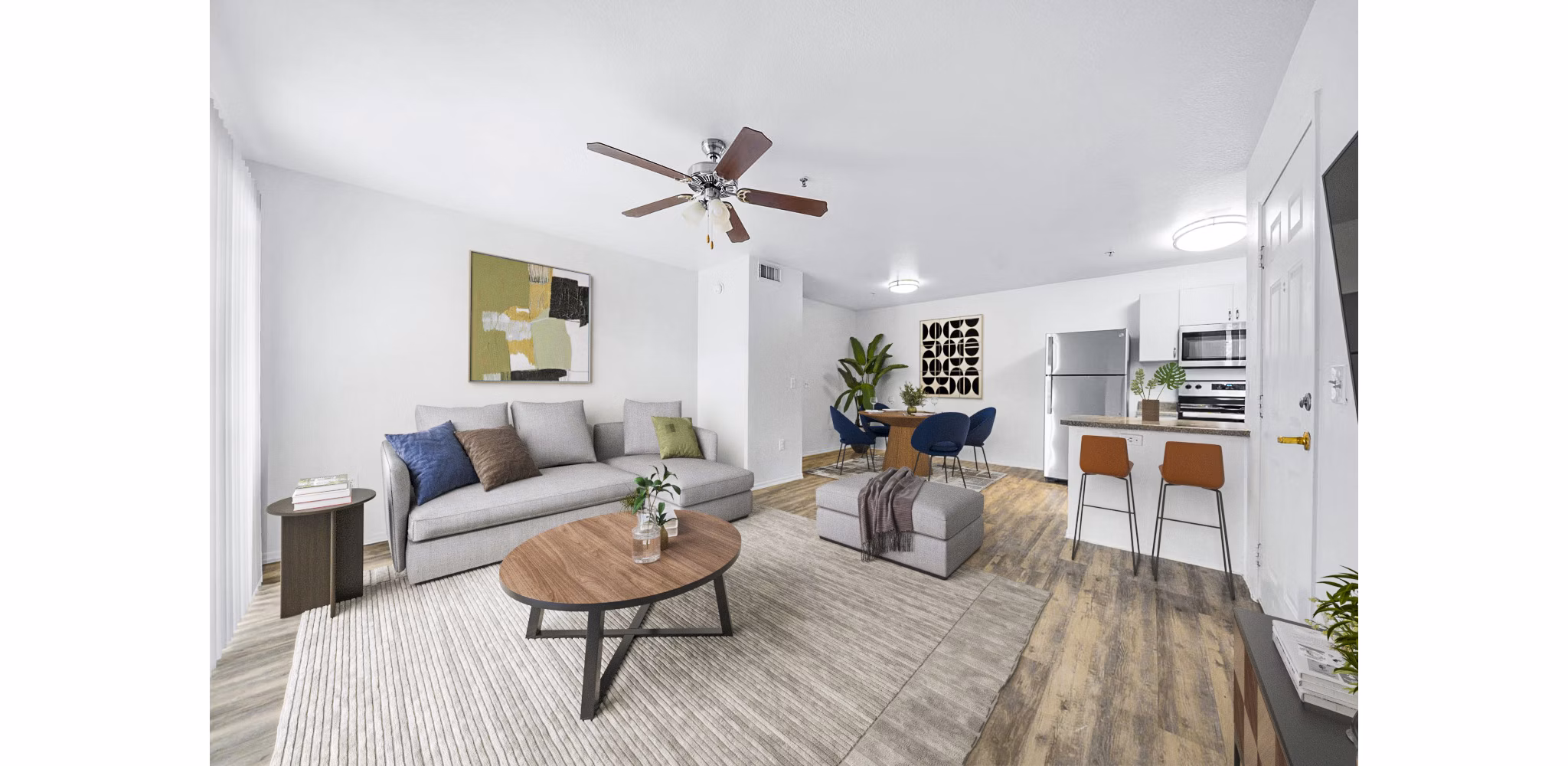 Spacious living room with modern furnishings at The Colony Apartments, offering luxury living in exclusive surroundings