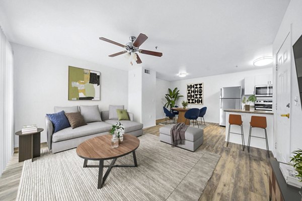 Spacious living room with modern furnishings at The Colony Apartments, offering luxury living in exclusive surroundings