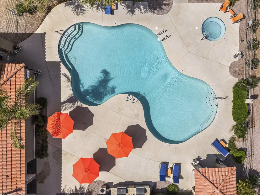 Luxurious hot tub and pool at The Colony Apartments offering relaxation and leisure in a high-end community setting
