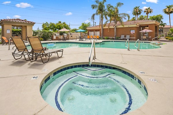 Luxurious hot tub and pool at The Colony Apartments offering relaxation and leisure in a high-end community setting