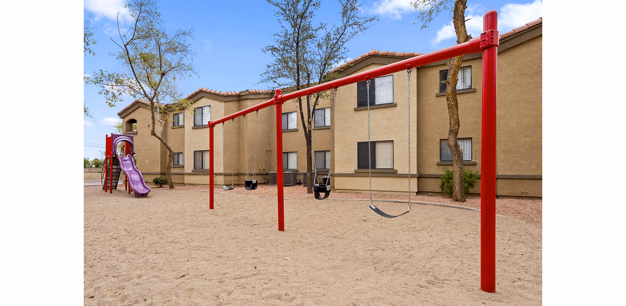 The Colony Apartments: Modern playground with colorful equipment at luxury residences