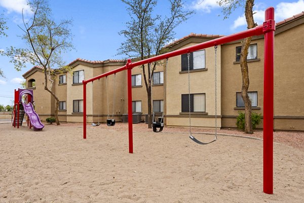 The Colony Apartments: Modern playground with colorful equipment at luxury residences
