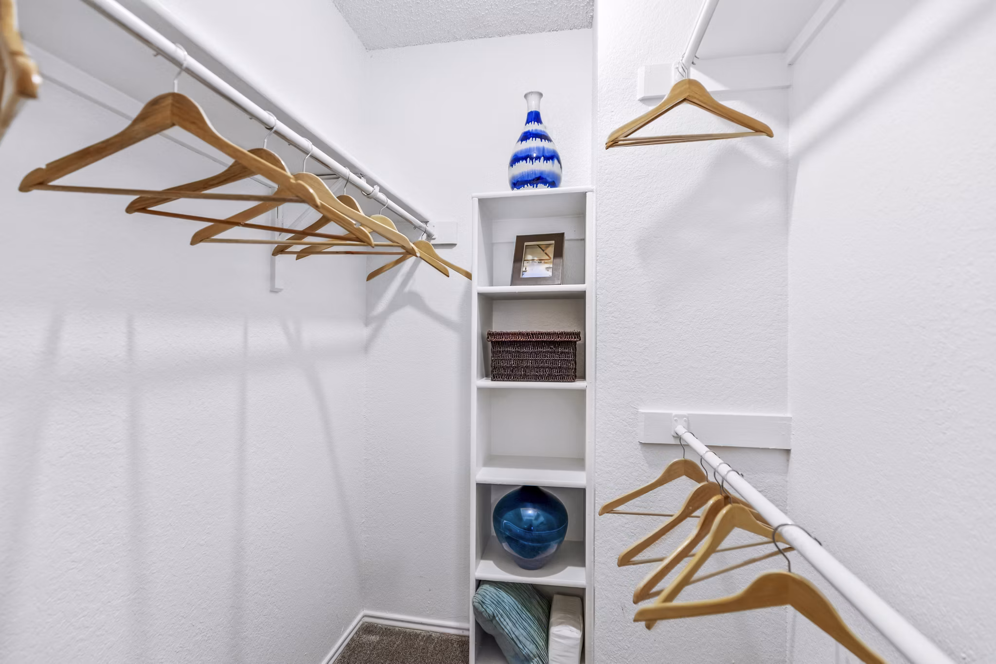 The Georgian Apartments: Bedroom closet with custom shelving and ample storage space in luxury apartments