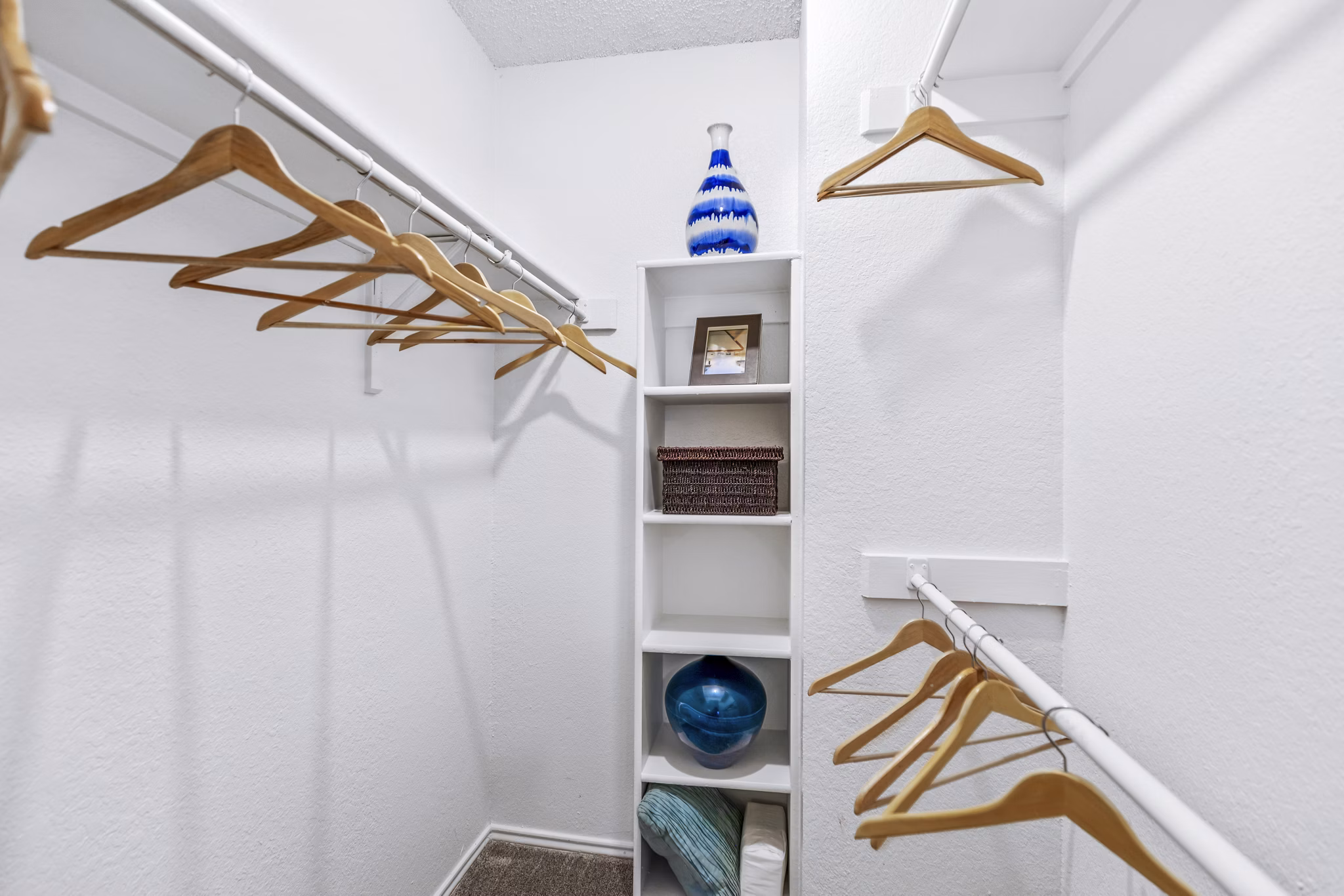 The Georgian Apartments: Bedroom closet with custom shelving and ample storage space in luxury apartments