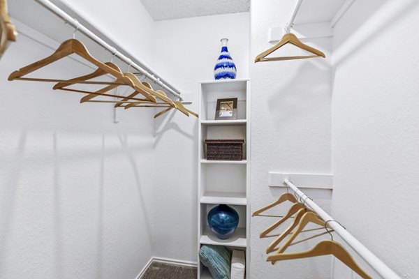 The Georgian Apartments: Bedroom closet with custom shelving and ample storage space in luxury apartments