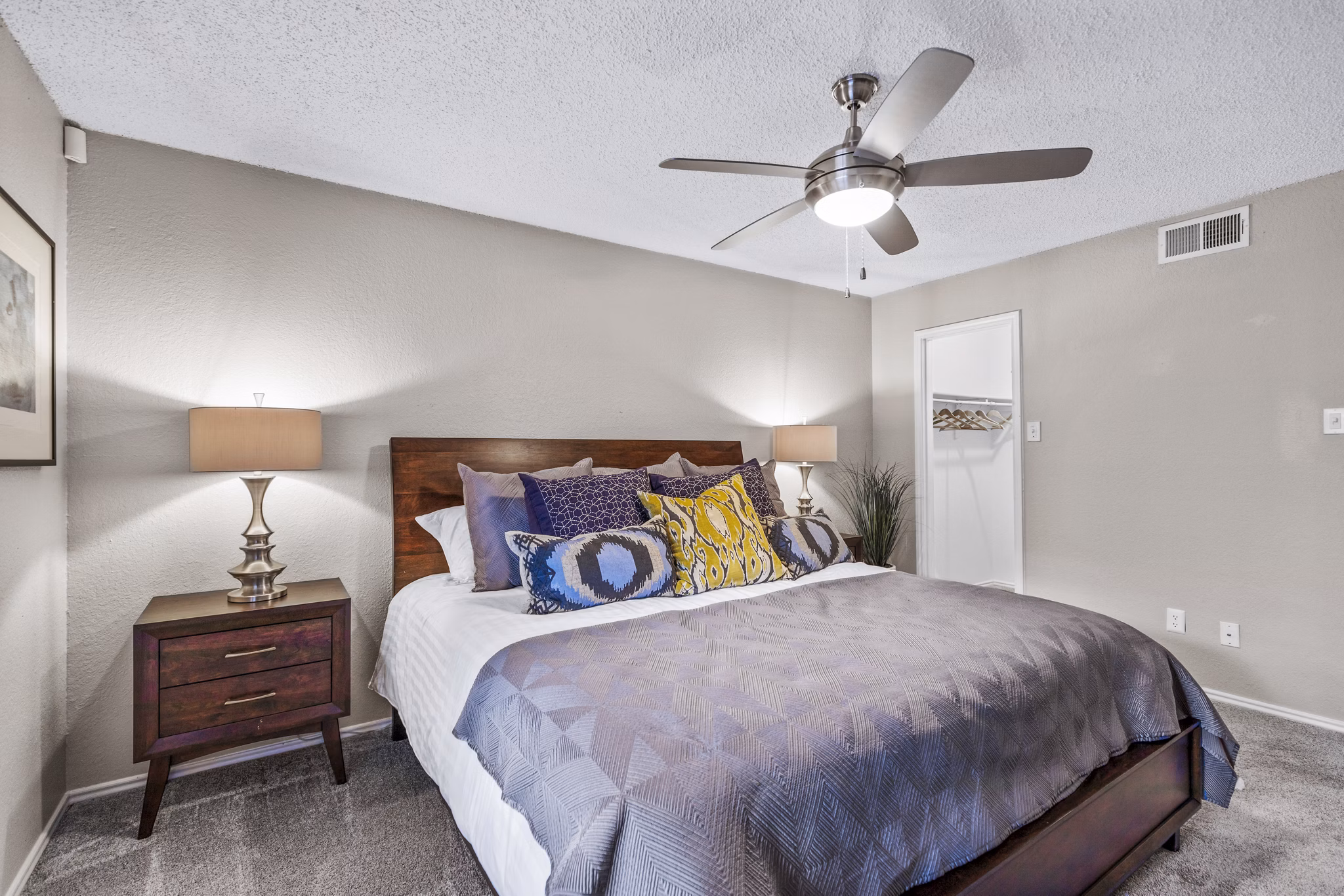 Elegant bedroom with soft lighting and modern decor in The Georgian Apartments, offering luxury living