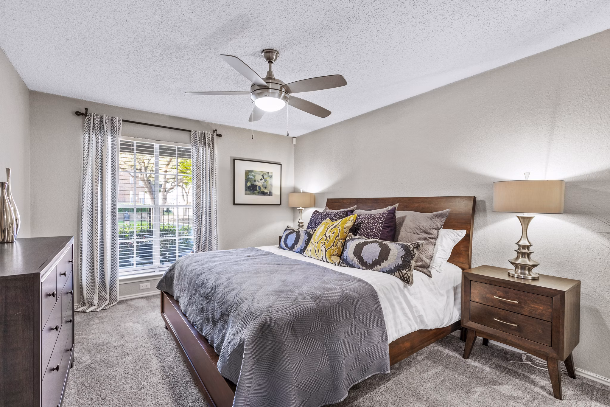 Bedroom with elegant furnishings at The Georgian Apartments, Greystar luxury apartments in an attractive urban setting