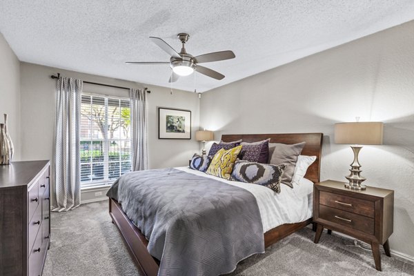 Bedroom with elegant furnishings at The Georgian Apartments, Greystar luxury apartments in an attractive urban setting