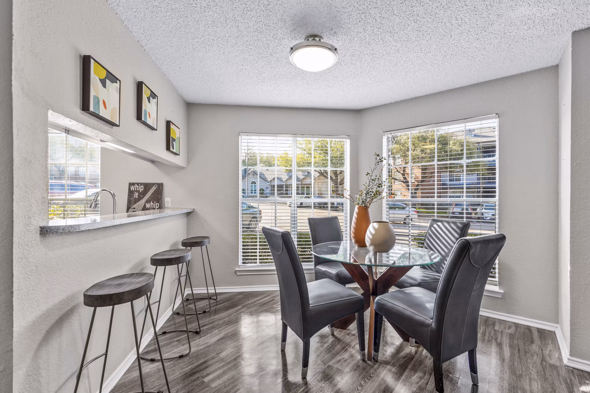Dining room featuring elegant decor and modern lighting at The Georgian Apartments