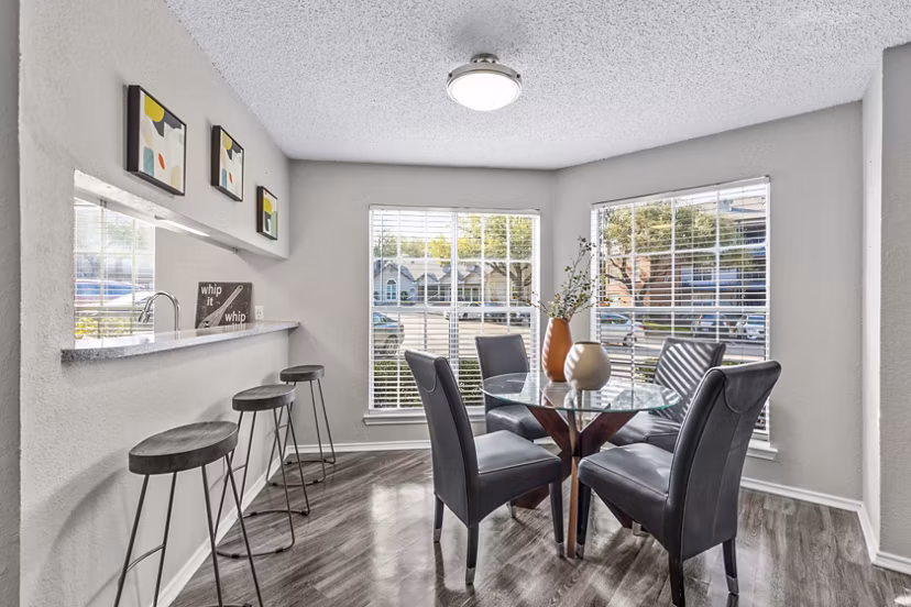 Dining room featuring elegant decor and modern lighting at The Georgian Apartments