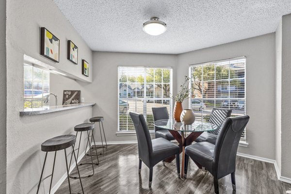 Dining room featuring elegant decor and modern lighting at The Georgian Apartments