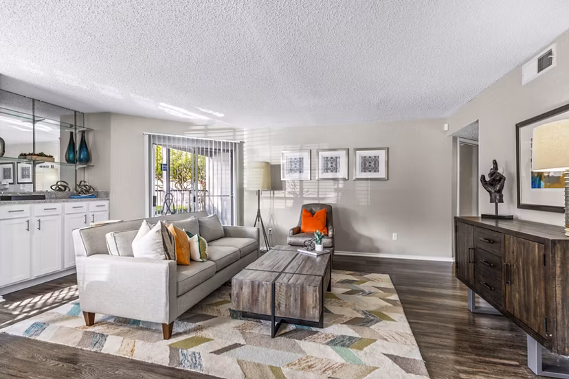 Contemporary living room with sleek furnishings and modern lighting at The Georgian Apartments