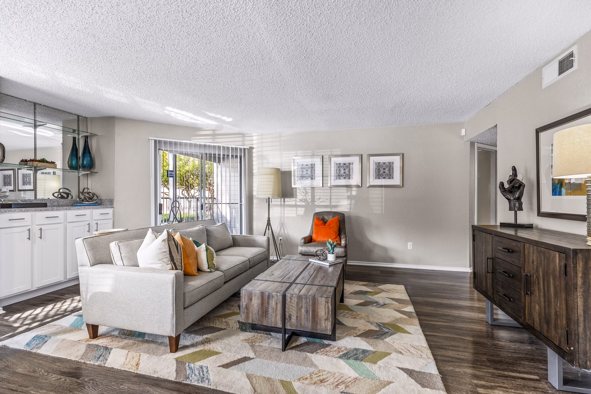 Contemporary living room with sleek furnishings and modern lighting at The Georgian Apartments