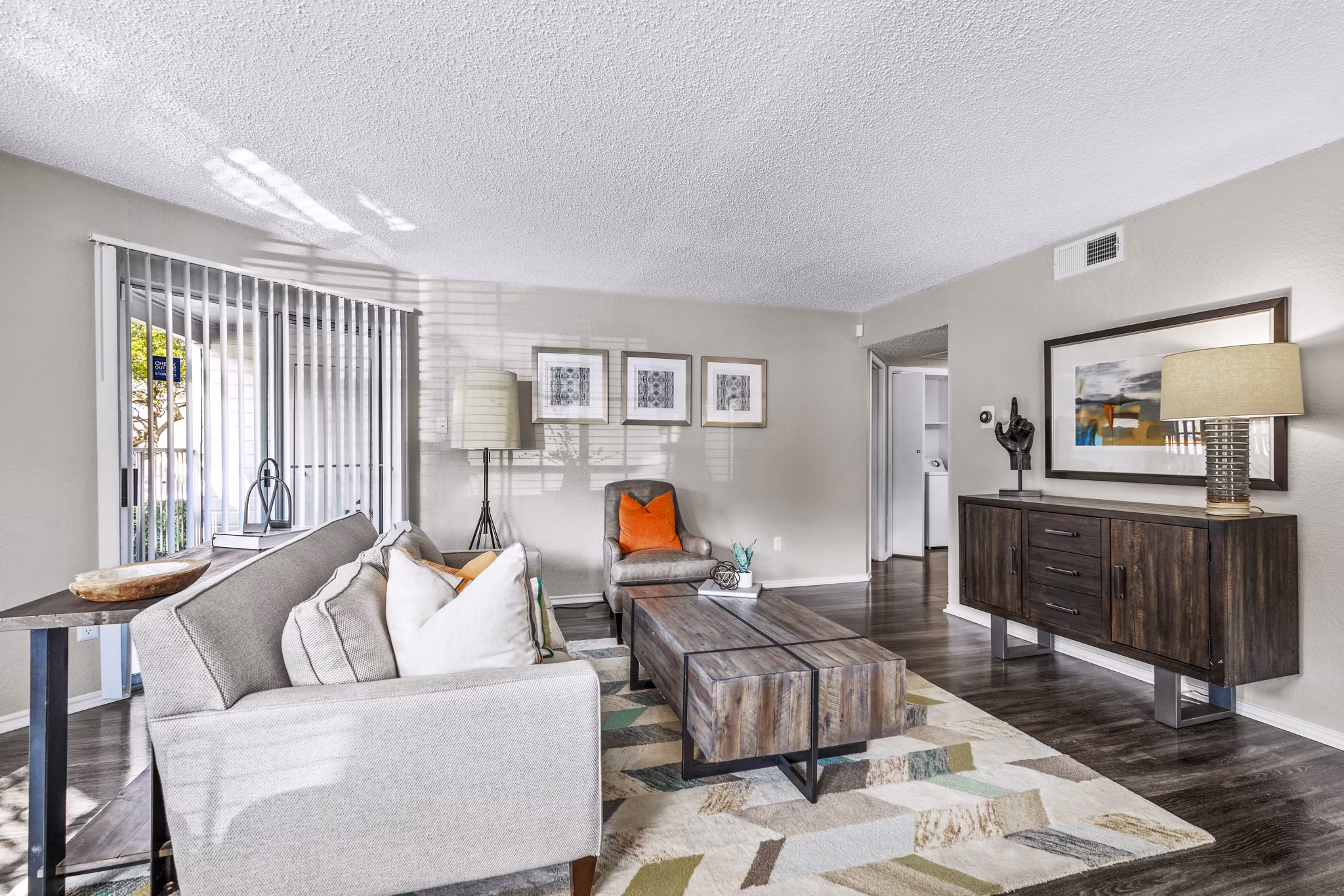 Spacious living room with modern decor in The Georgian Apartments
