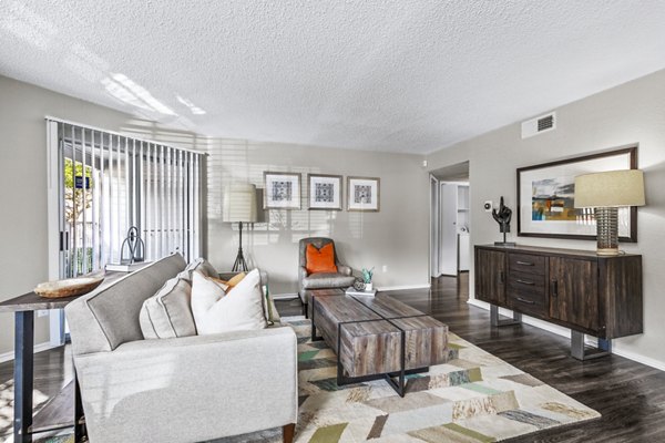 Spacious living room with modern decor in The Georgian Apartments