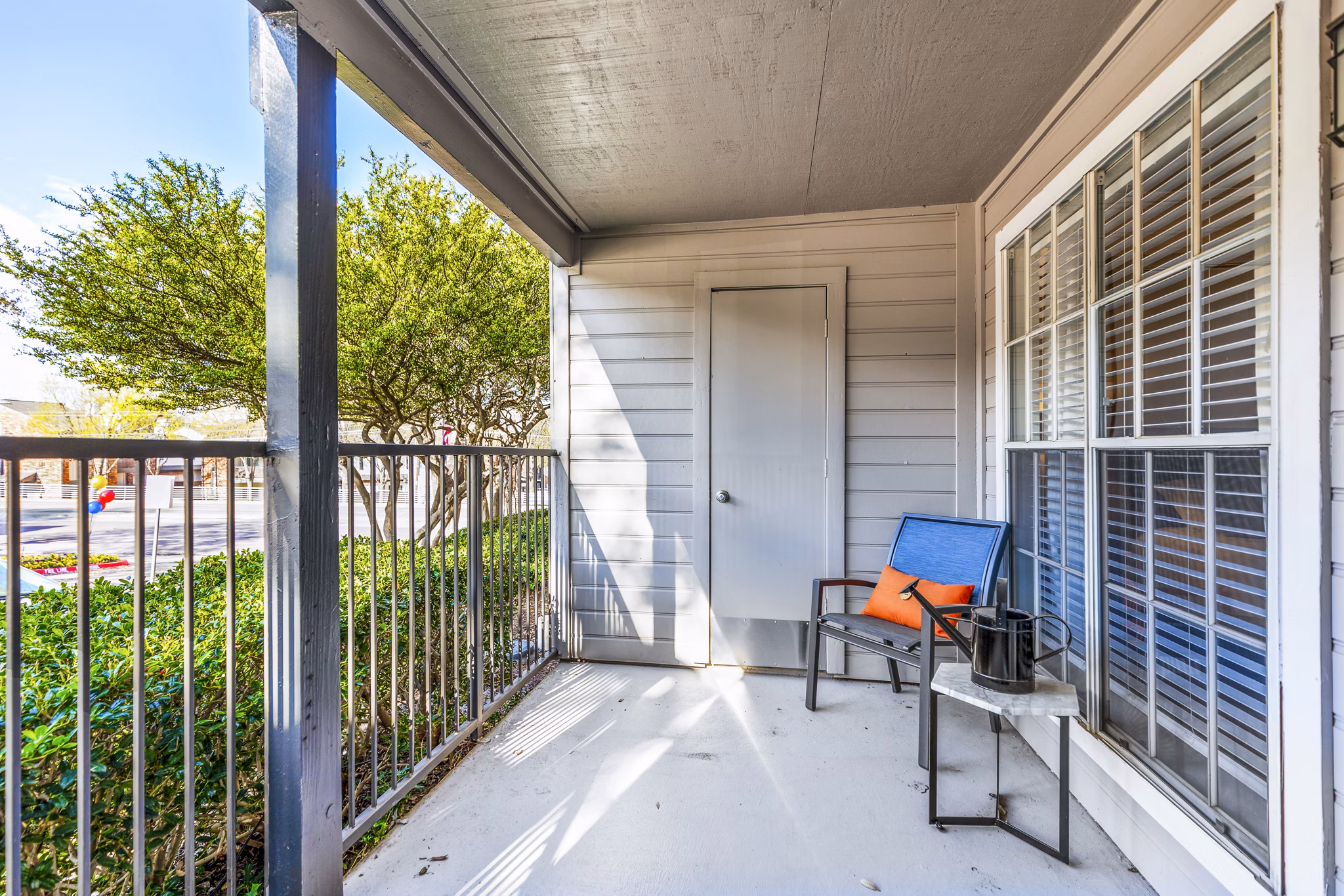 Patio with seating and garden view at The Georgian Apartments