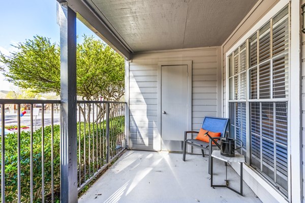Patio with seating and garden view at The Georgian Apartments