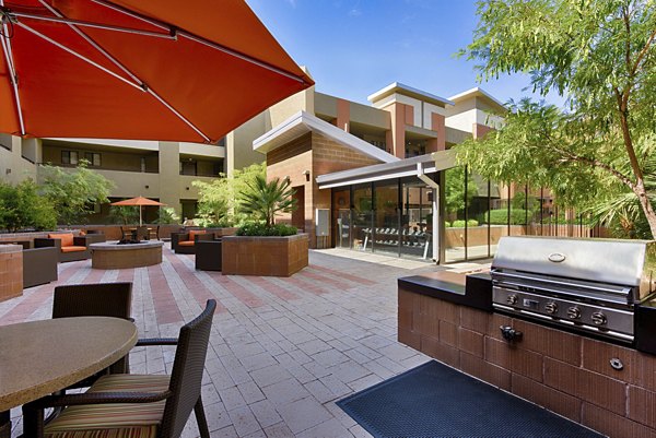Outdoor grill area with modern seating at Ten Wine Lofts Apartments for social gatherings and leisure