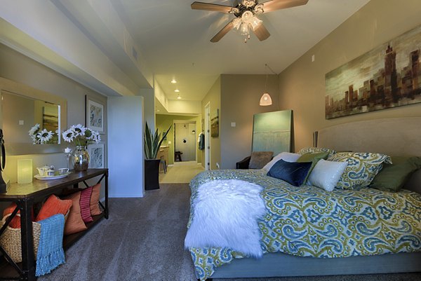 Cozy bedroom with contemporary decor at Ten Wine Lofts Apartments