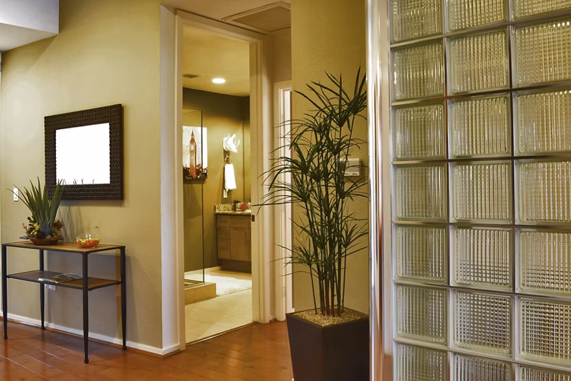 Hallway with modern lighting and artwork at Ten Wine Lofts Apartments, offering luxury living in a vibrant community
