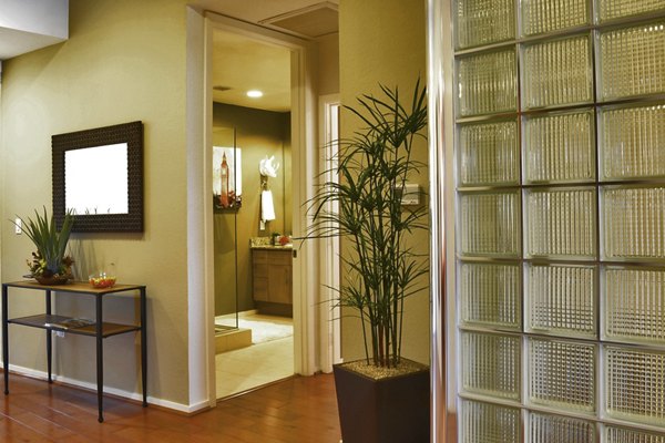 Hallway with modern lighting and artwork at Ten Wine Lofts Apartments, offering luxury living in a vibrant community