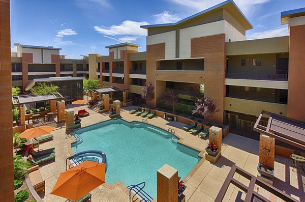 Resort-style pool with sun loungers at Ten Wine Lofts Apartments