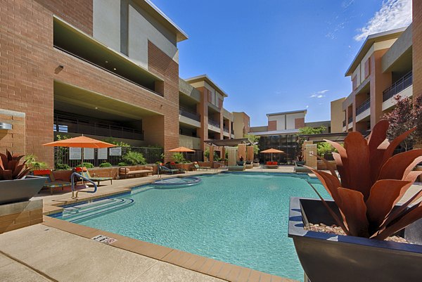 Sparkling pool with modern loungers at Ten Wine Lofts Apartments in a luxury setting