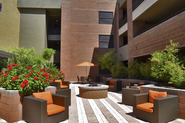 Fire pit lounge area with cozy seating at Ten Wine Lofts Apartments, perfect for outdoor relaxation and social gatherings