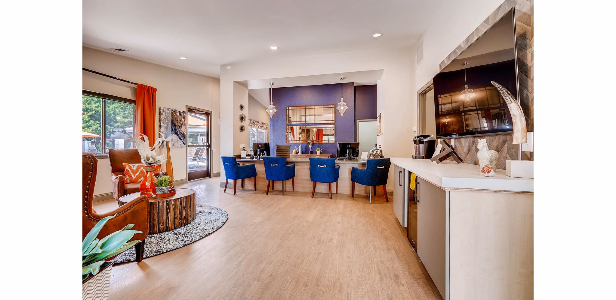 Clubhouse featuring modern design and cozy seating at Canyon Reserve at the Ranch Apartments