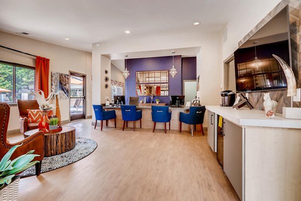 Clubhouse featuring modern design and cozy seating at Canyon Reserve at the Ranch Apartments