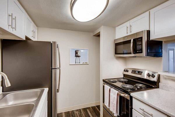 Modern kitchen with stainless steel appliances at Canyon Reserve at the Ranch Apartments