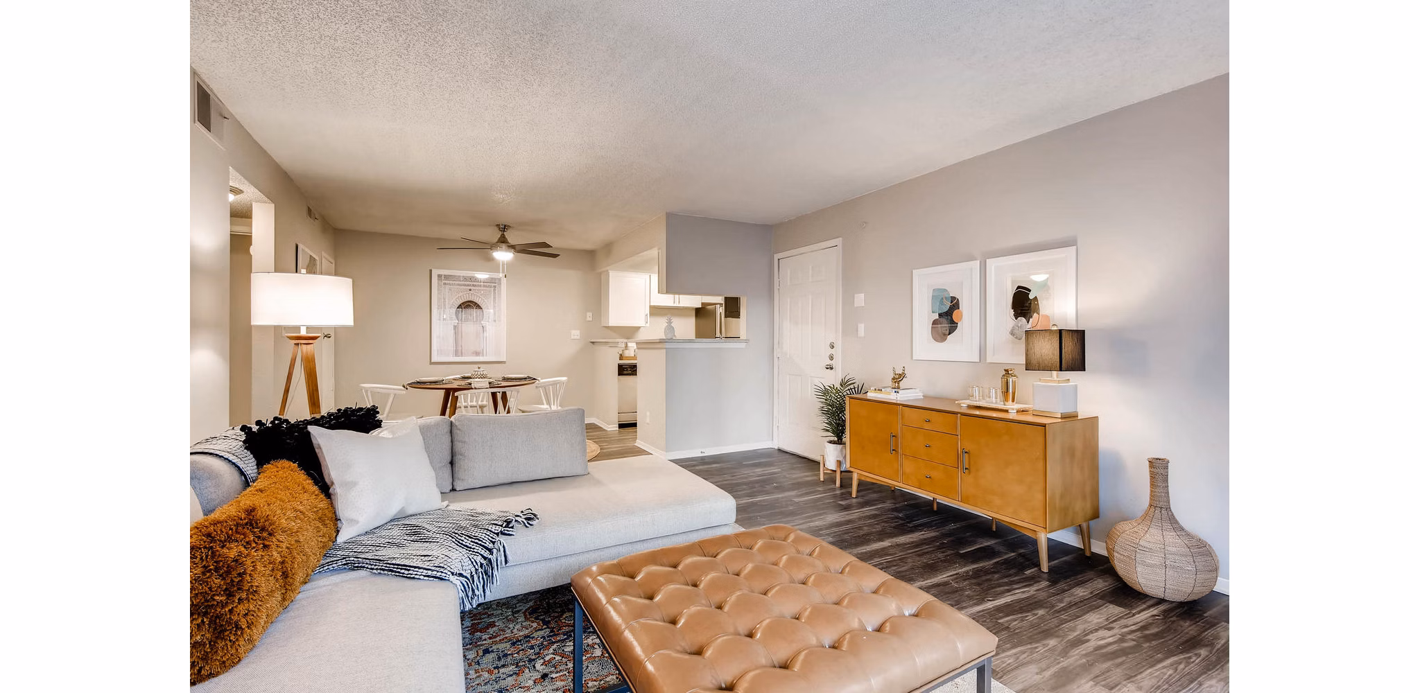 Living room with modern furnishings and natural light at Canyon Reserve at the Ranch Apartments