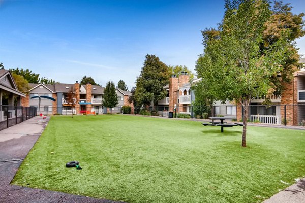 Canyon Reserve at the Ranch: Tranquil courtyard with lush greenery and seating areas in luxury apartments