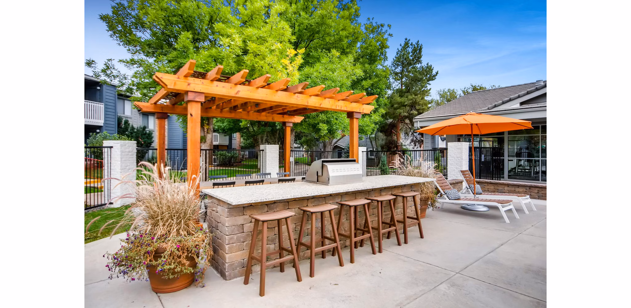 Grill area with outdoor seating at Canyon Reserve at the Ranch Apartments, ideal for entertaining and relaxation in a luxury setting