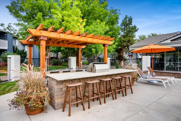 Grill area with outdoor seating at Canyon Reserve at the Ranch Apartments, ideal for entertaining and relaxation in a luxury setting