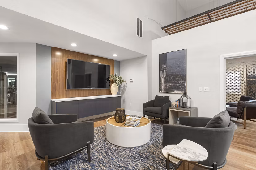 Modern clubhouse featuring cozy seating and entertainment options at Avana Star Lake Apartments