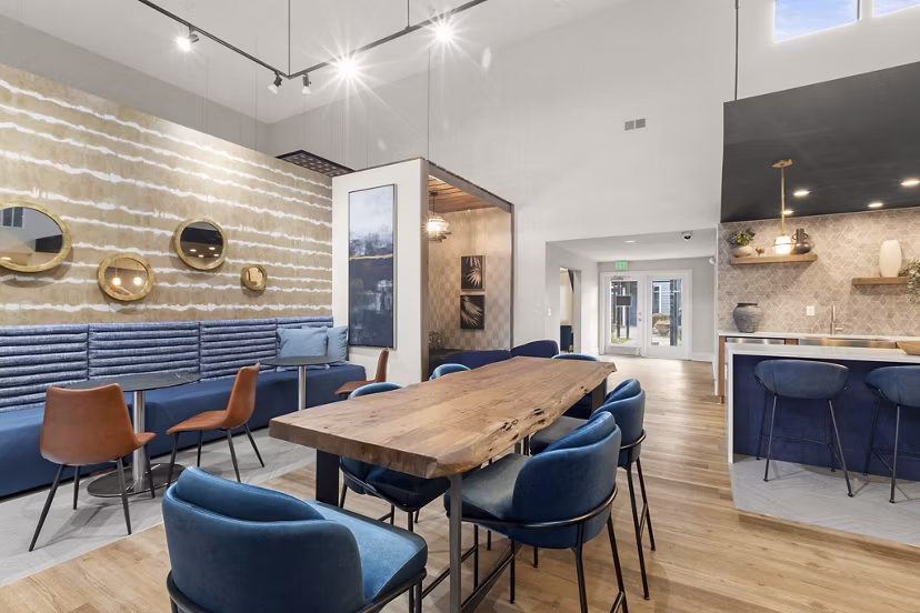 Clubhouse featuring modern design and cozy seating at Avana Star Lake Apartments