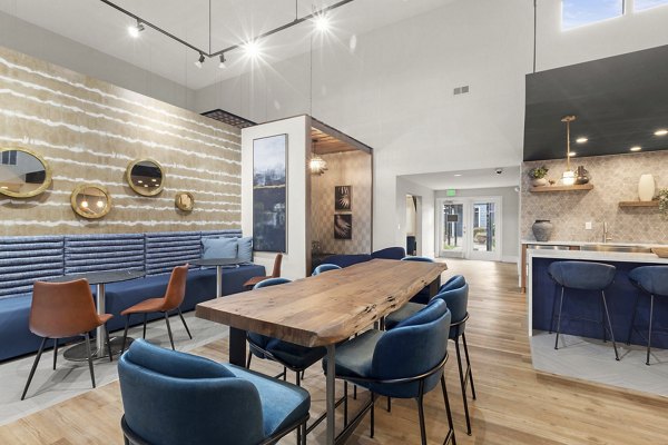 Clubhouse featuring modern design and cozy seating at Avana Star Lake Apartments