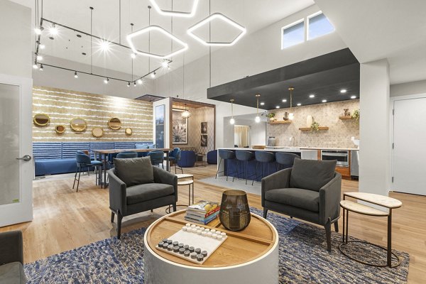 Clubhouse featuring modern design and cozy seating at Avana Star Lake Apartments
