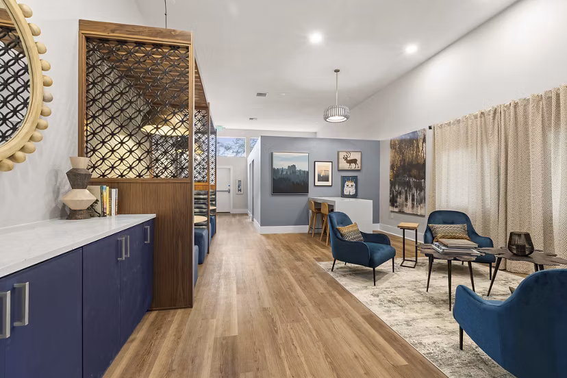 Clubhouse featuring modern design and cozy seating at Avana Star Lake Apartments
