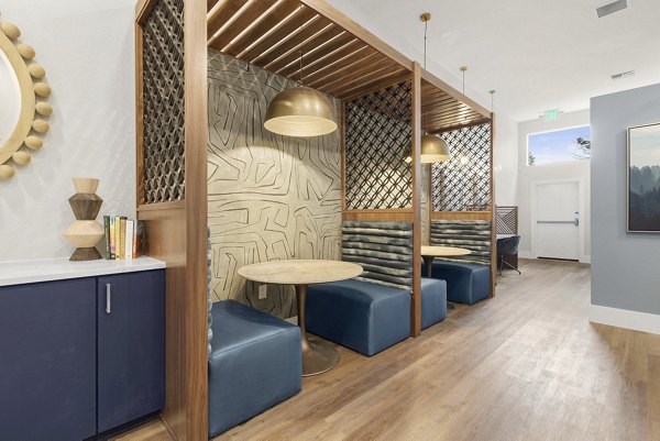 Clubhouse featuring modern decor and open seating at Avana Star Lake Apartments