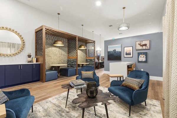 Clubhouse featuring modern lounge area and entertainment space at Avana Star Lake Apartments