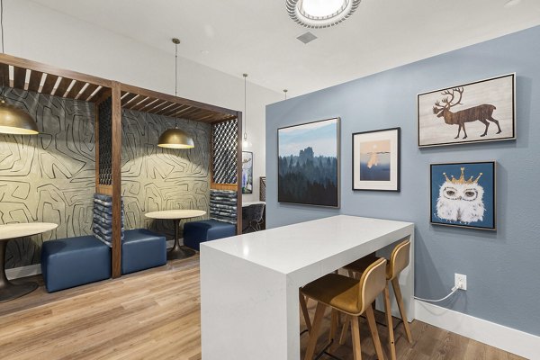 Clubhouse at Avana Star Lake Apartments featuring modern design and ample seating areas for social gatherings and events