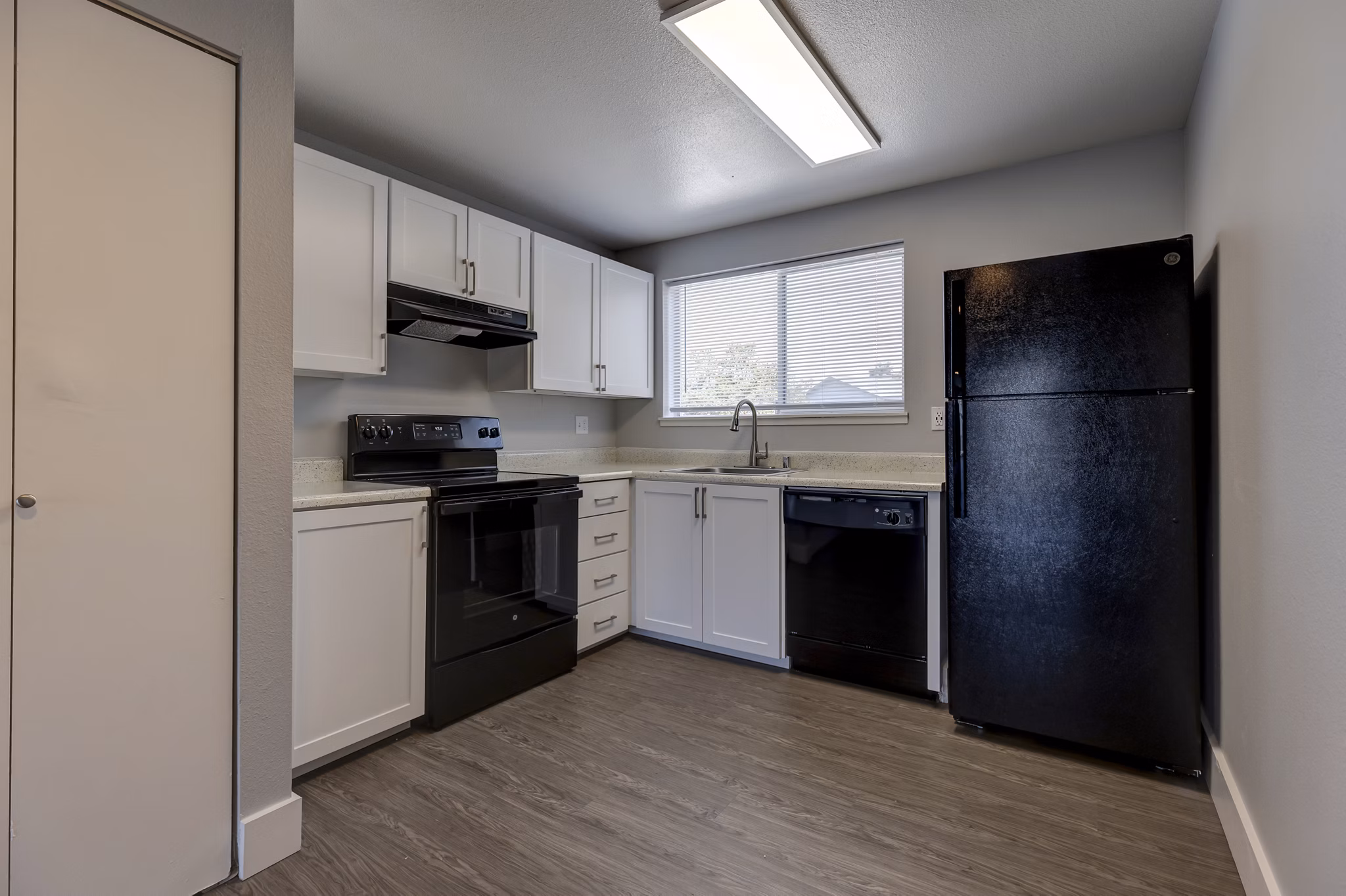 Avana Star Lake Apartments: Modern kitchen with stainless steel appliances and sleek cabinetry