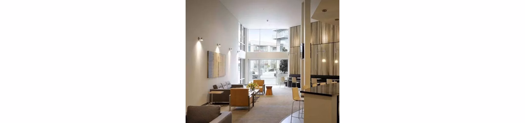 Clubhouse at On the Park Apartments featuring modern design and comfortable seating spaces for residents to enjoy
